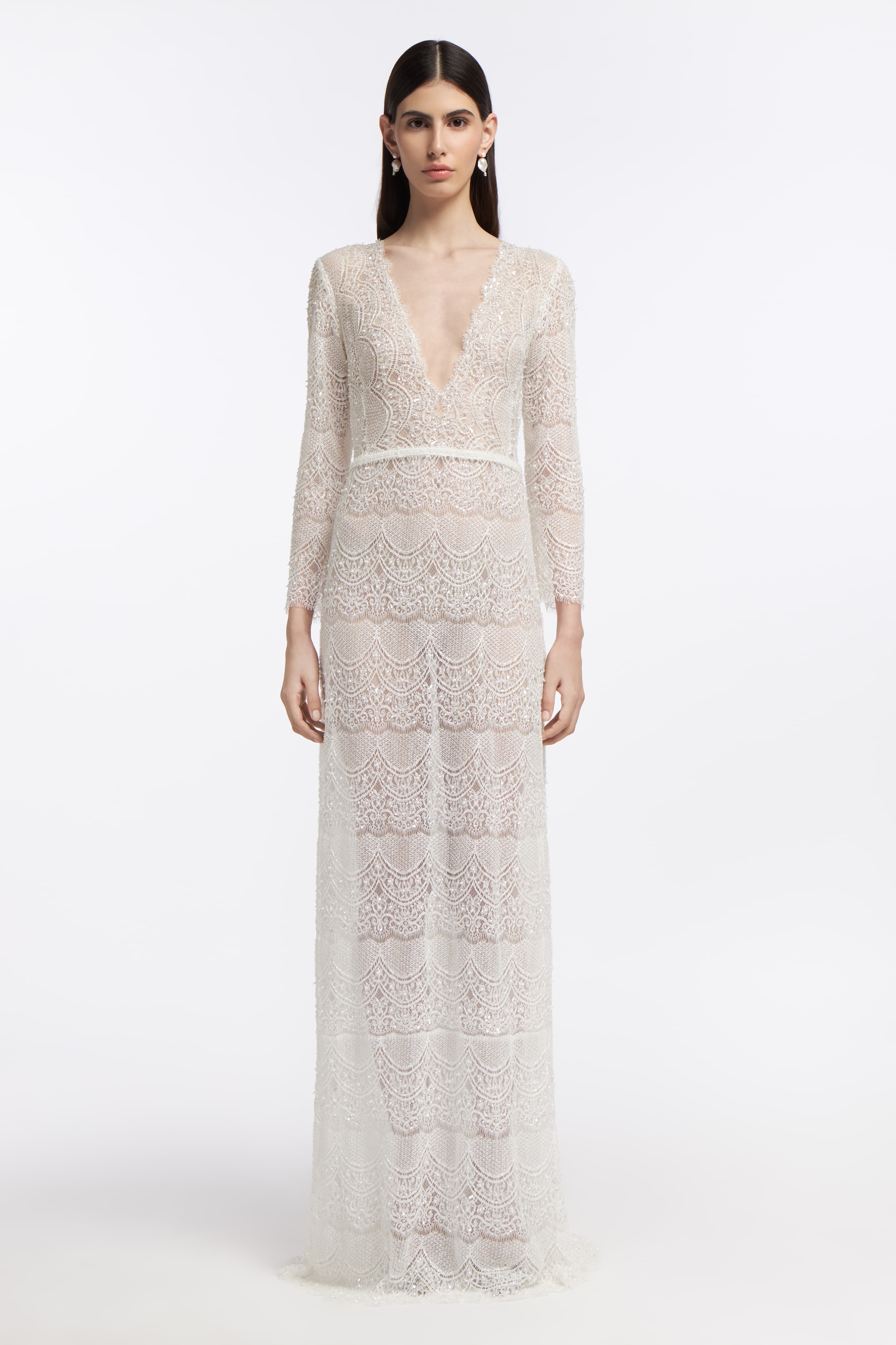 Minthe Beaded French Lace Gown featuring a deep V-neckline, long sleeves, and intricate lace detailing. Elegant bridal dress for Spring 2025 weddings.