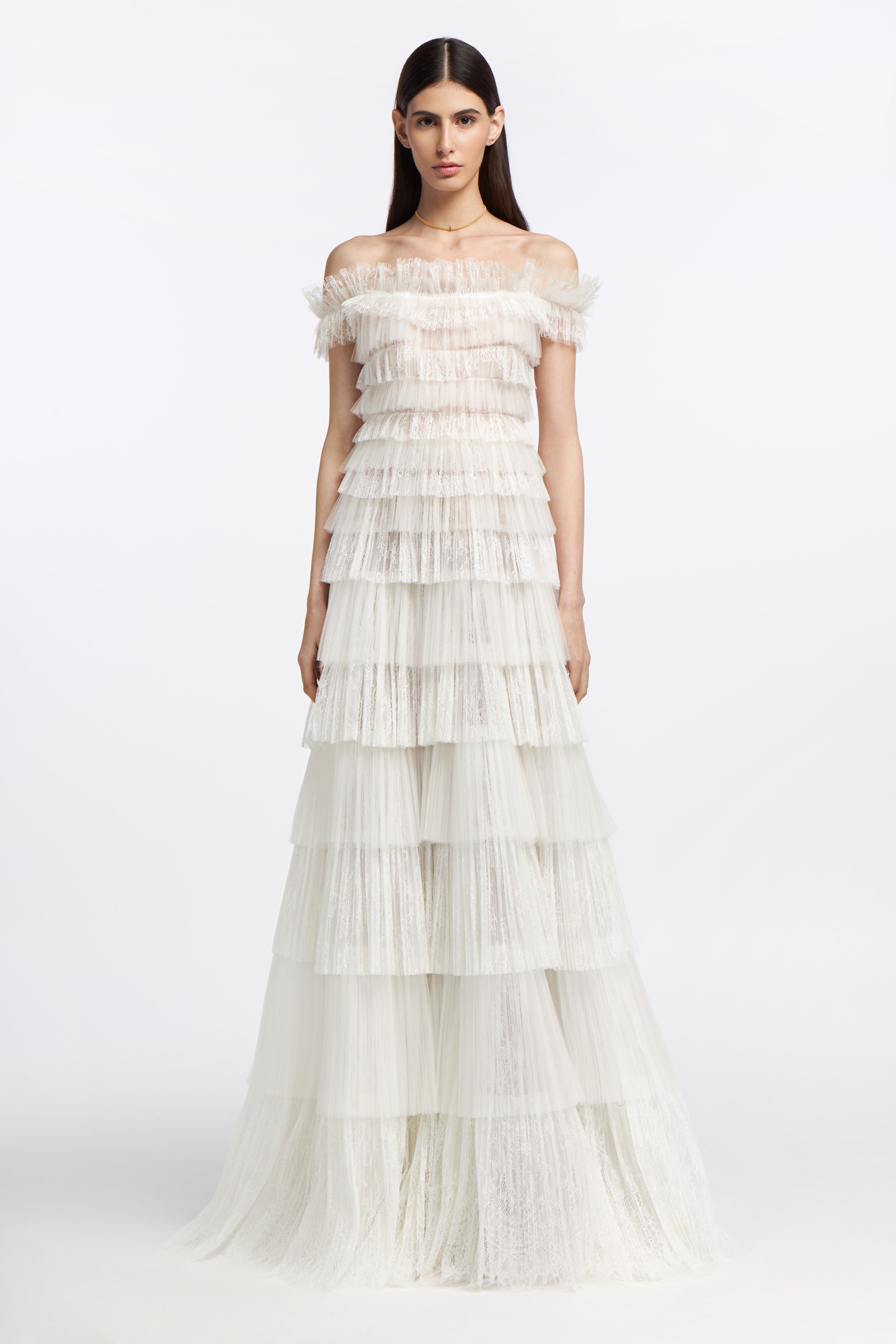 Amalthia Plissé Lace Gown featuring tiered lace ruffles and an off-the-shoulder neckline, perfect for a bridal look from the Spring 2025 collection.