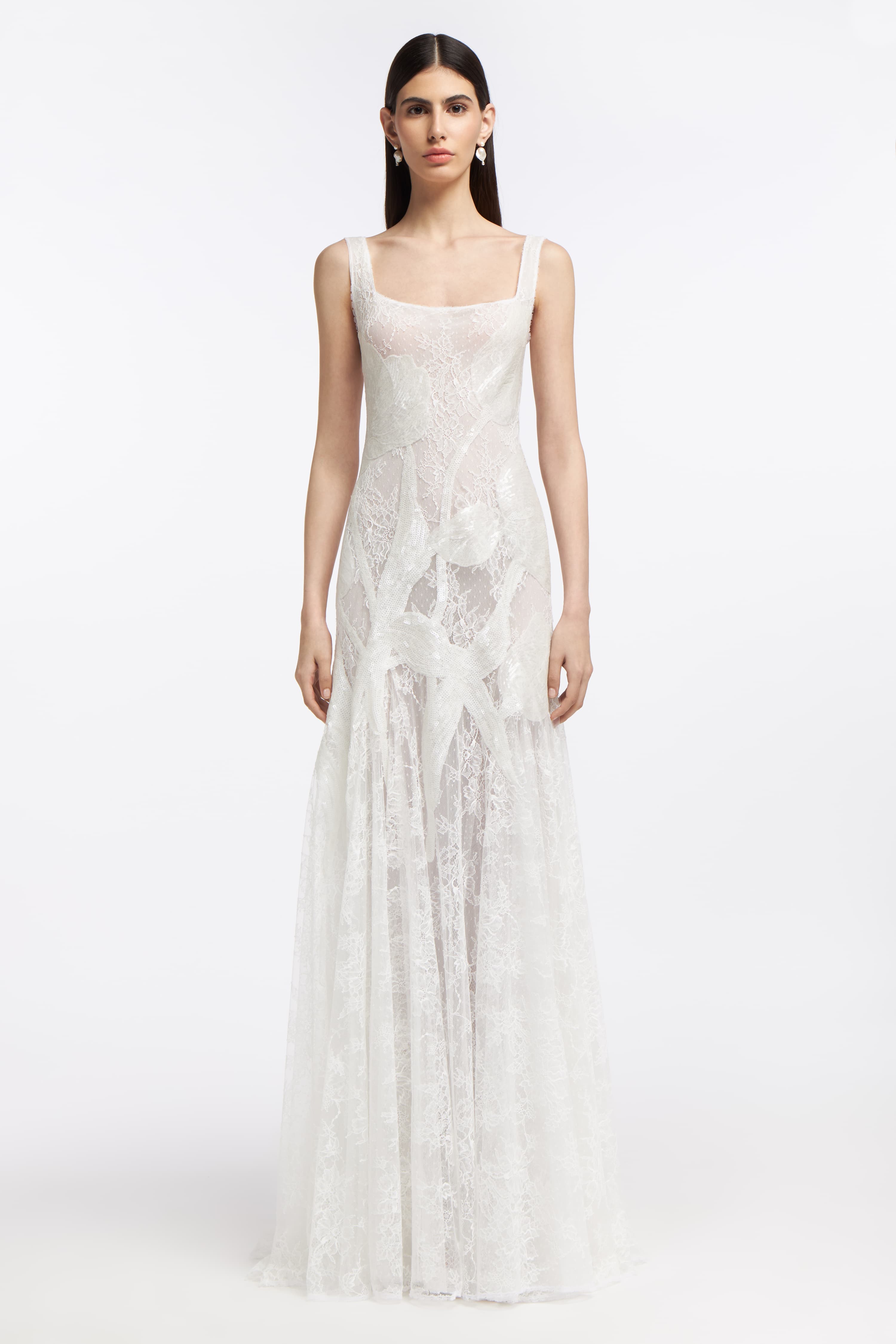 Eudora Chantilly Lace Gown featuring a sheer lace design with a fitted bodice and flowing skirt, perfect for a bridal look from Spring 2025.