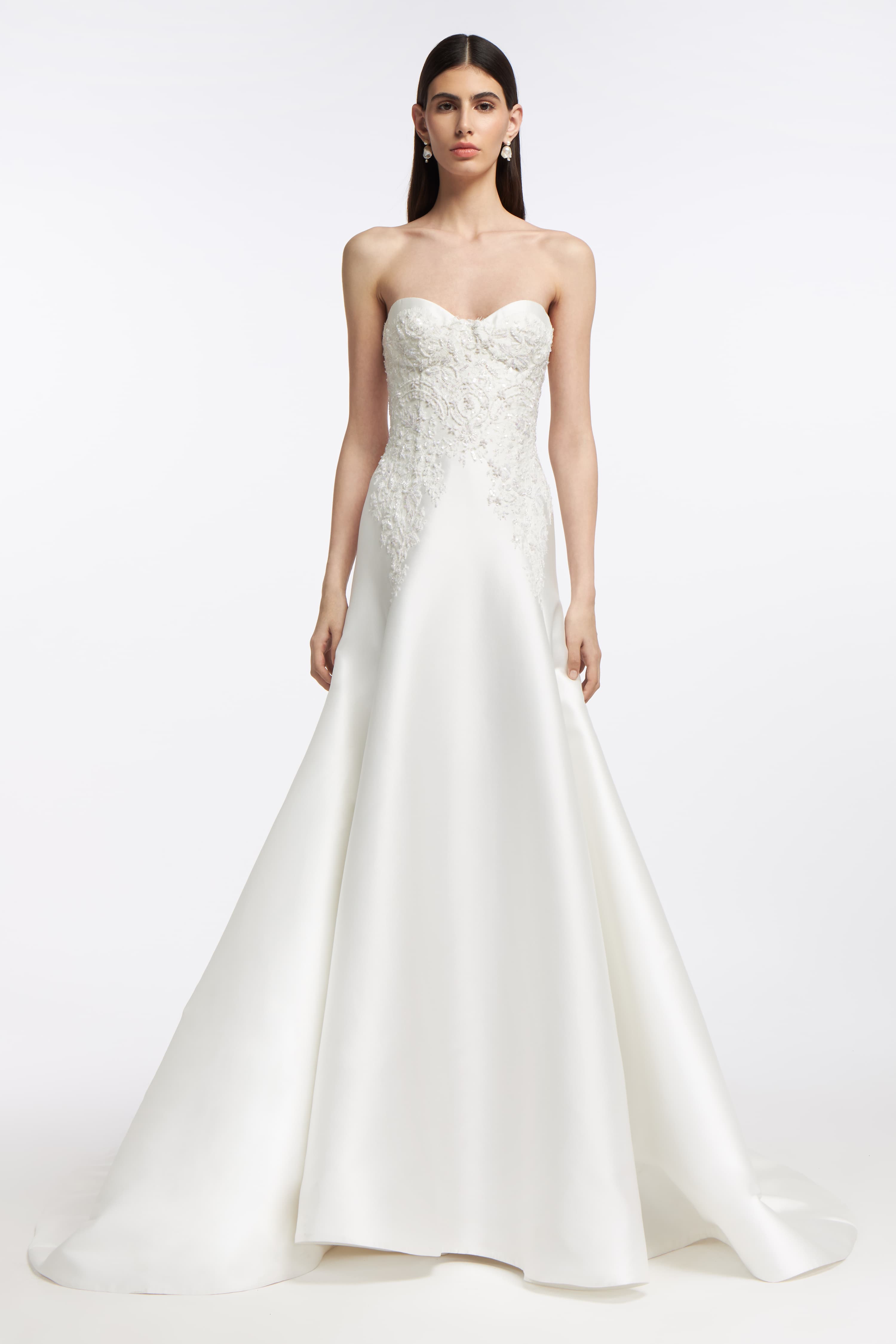 Eris Mikado Bustier Gown featuring a strapless sweetheart neckline, fitted bodice with intricate lace detailing, and a flowing A-line skirt.