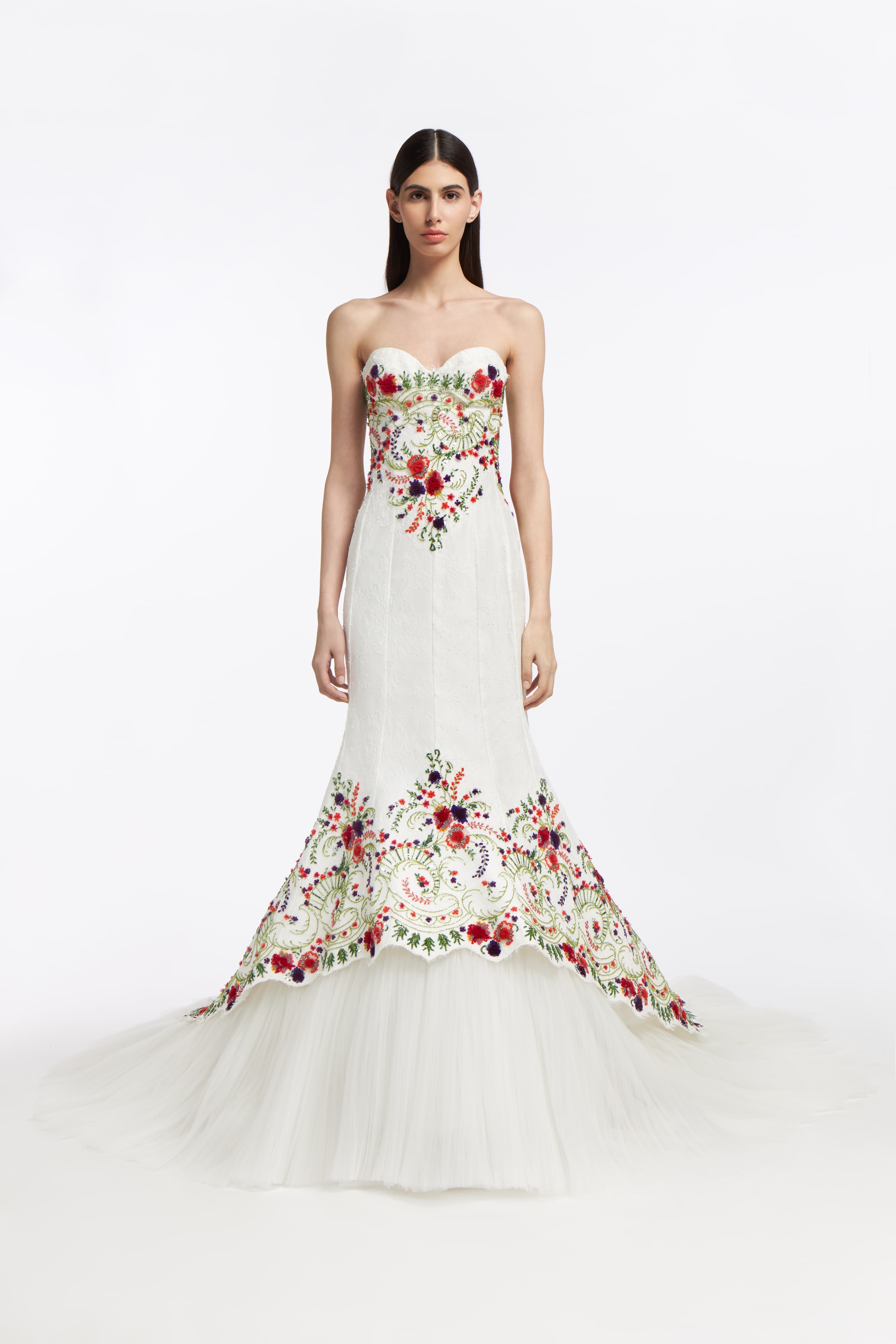 Melinoë Chantilly Lace Gown featuring a strapless sweetheart neckline, intricate floral embroidery, and a mermaid silhouette with a tulle train.
