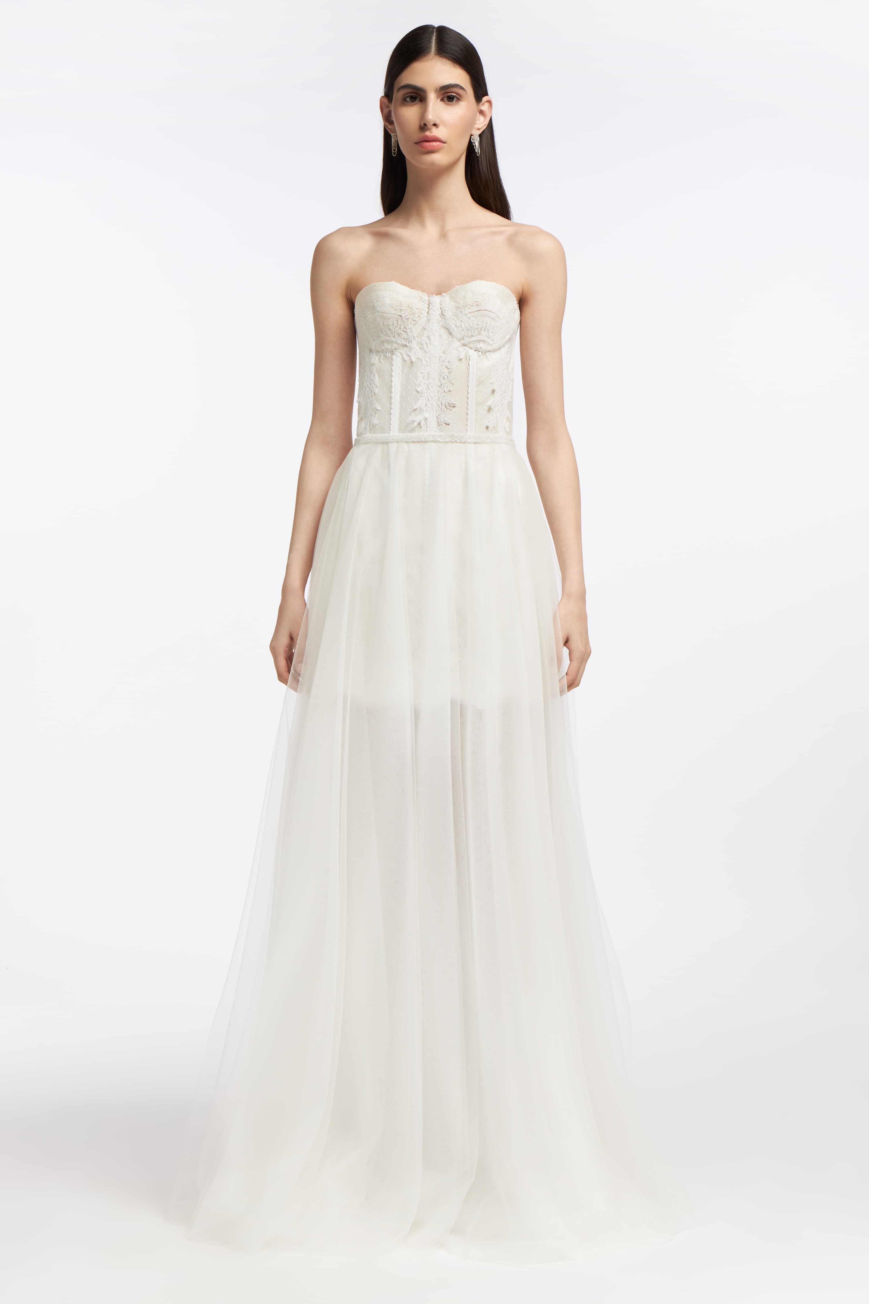 Melite French Tulle Bustier Mini Dress styled with a detachable sheer tulle overskirt, creating a versatile bridal ensemble for an elegant wedding day.