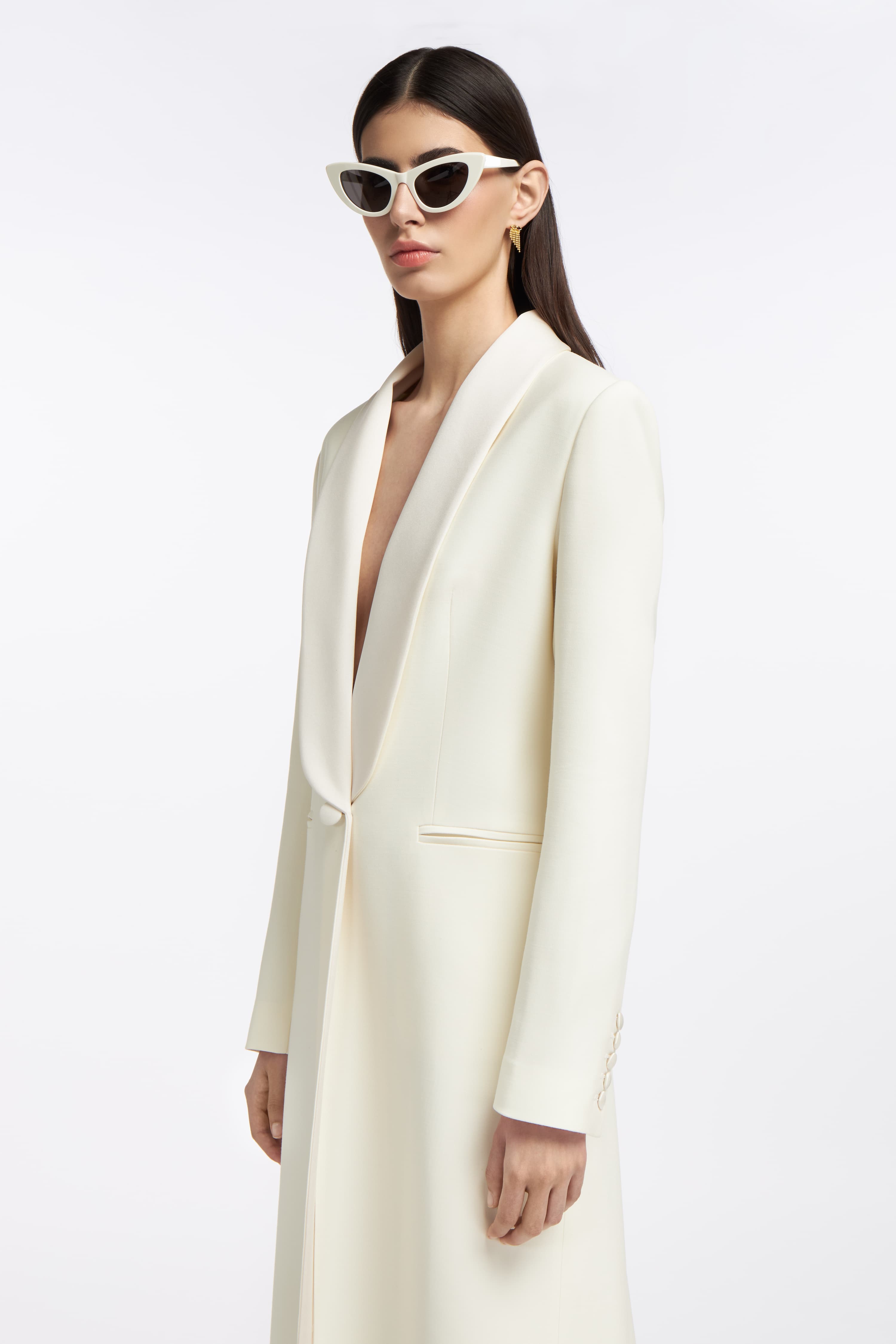 Side view of the Gaia Silk-blend Wool Coat, showcasing its elegant bridal design with structured shoulders, sleek tailoring, and a single-button closure.