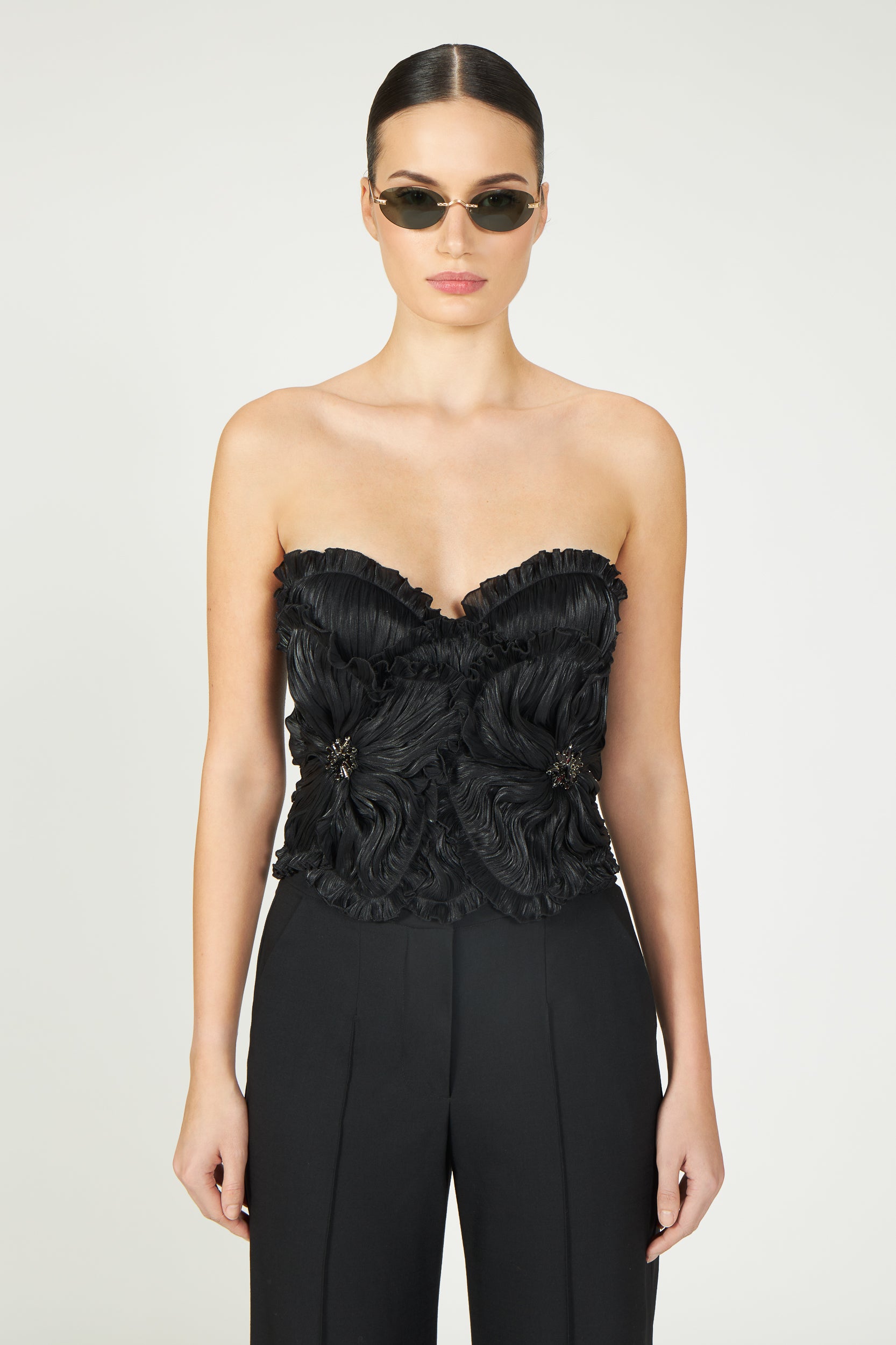 Ezra Lurex Georgette Bustier in black with intricate floral detailing and a strapless sweetheart neckline. A chic, structured top from Resort 2025 collection.