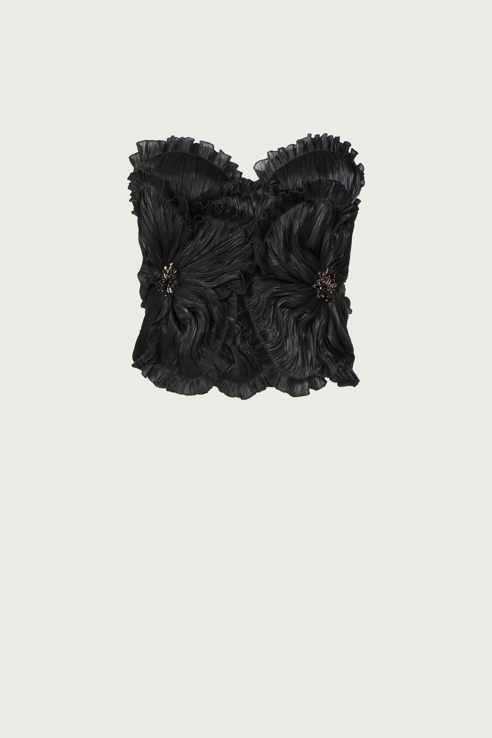 Ezra Lurex Georgette Bustier flat lay, highlighting its structured design, floral embellishments, and ruffled edges. A statement black top for any occasion.