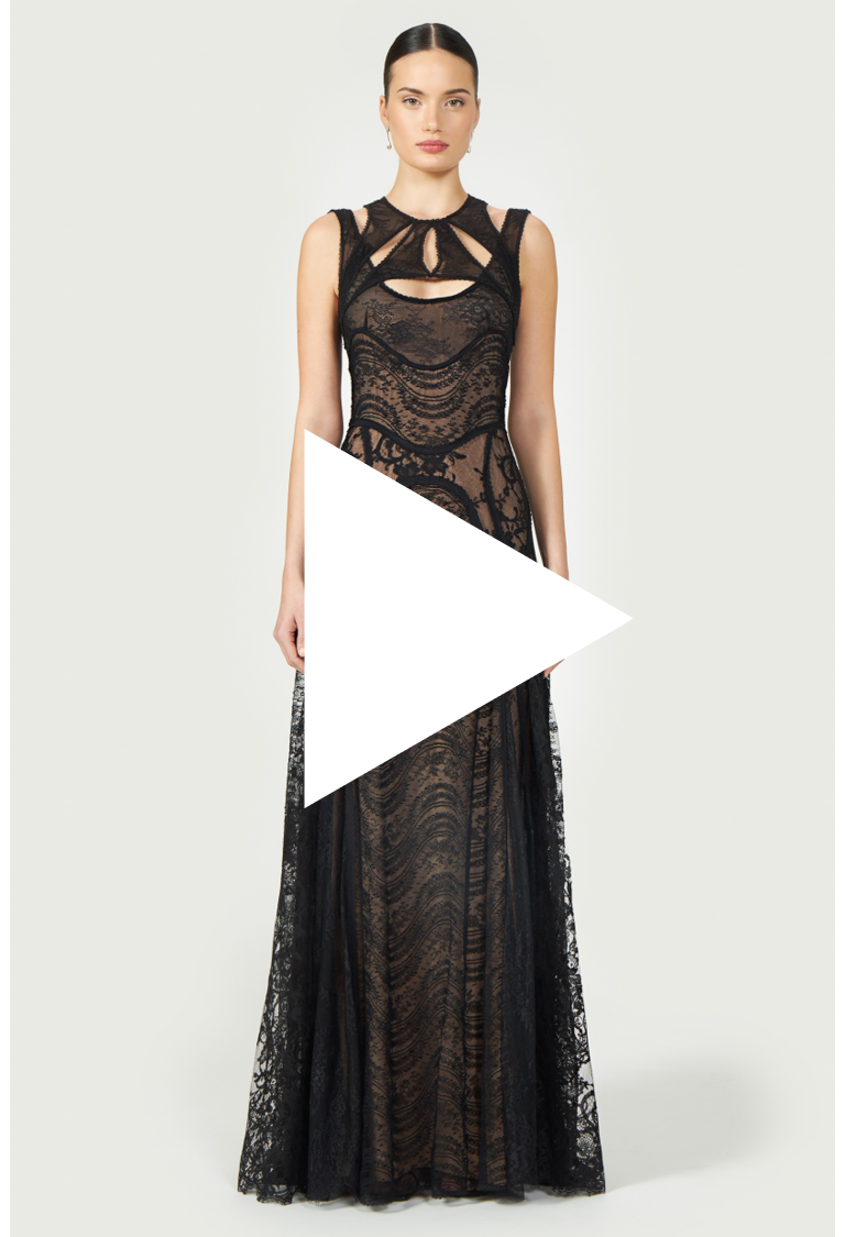 Video thumbnail of the Massima Patchwork Lace Gown, featuring a model wearing the black lace dress with cutout details and a flowing silhouette.