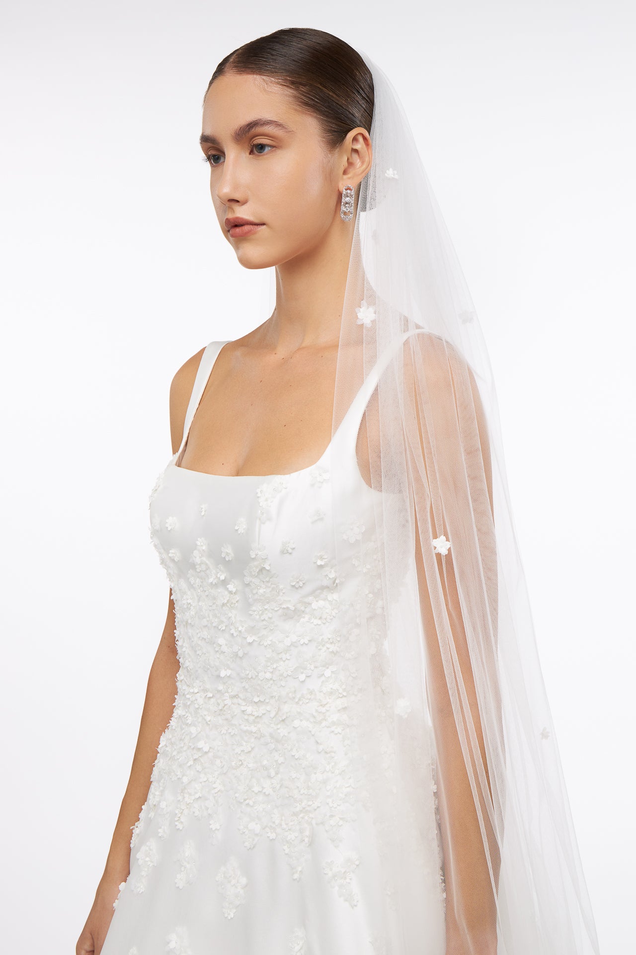 Elegant Floral Applique French Tulle Veil with delicate embroidered flowers, perfect for bridal wear. A timeless accessory for a wedding ensemble.