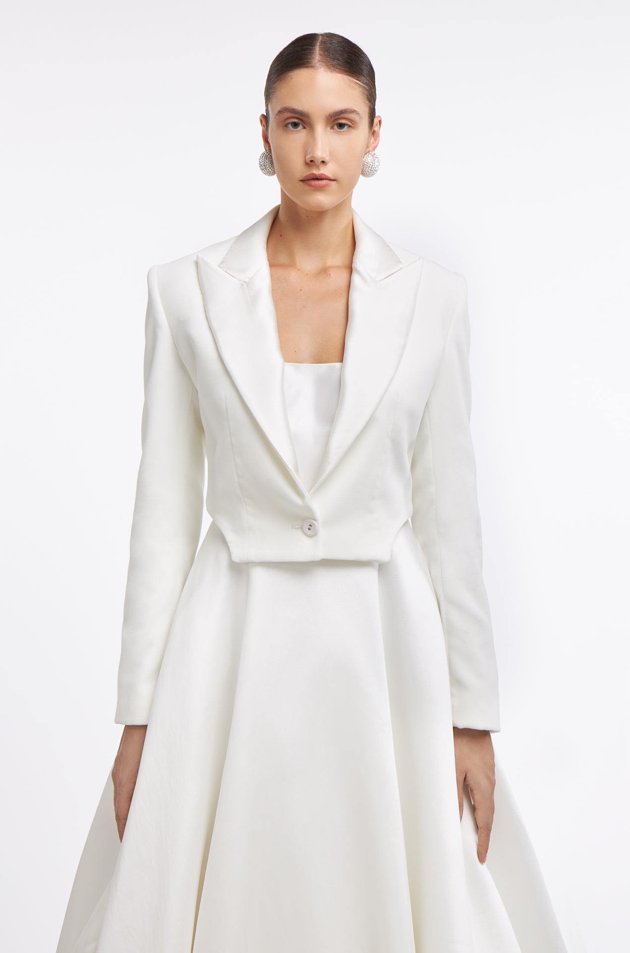Damara Mikado Gown styled with a cropped bridal jacket, adding a chic and contemporary touch. Ideal for versatile wedding day looks.