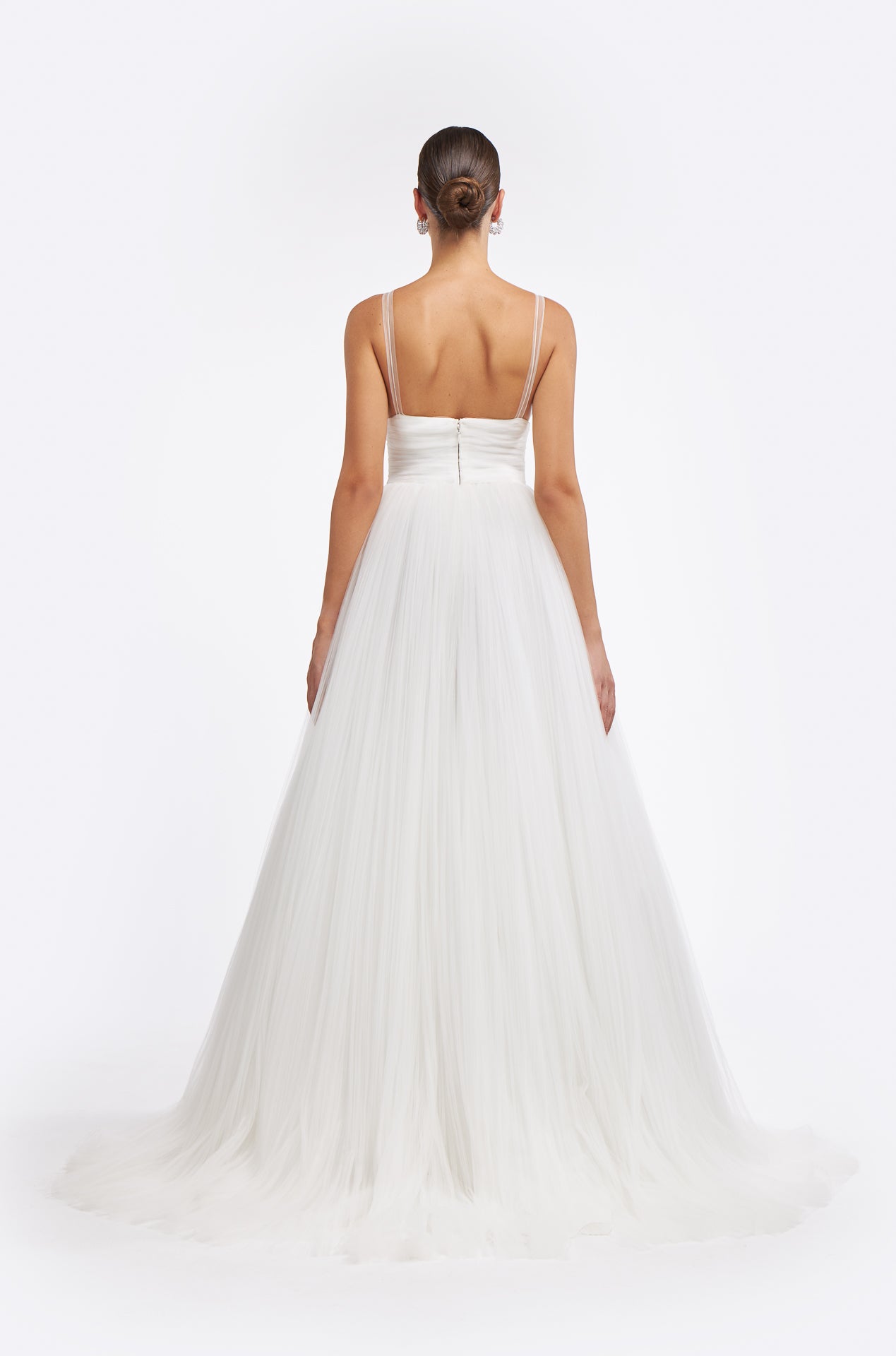 Back view of the Melantha Plissé French Tulle Gown with a fitted ruched bodice, sheer straps, and a flowing tulle skirt, ideal for a timeless wedding look.