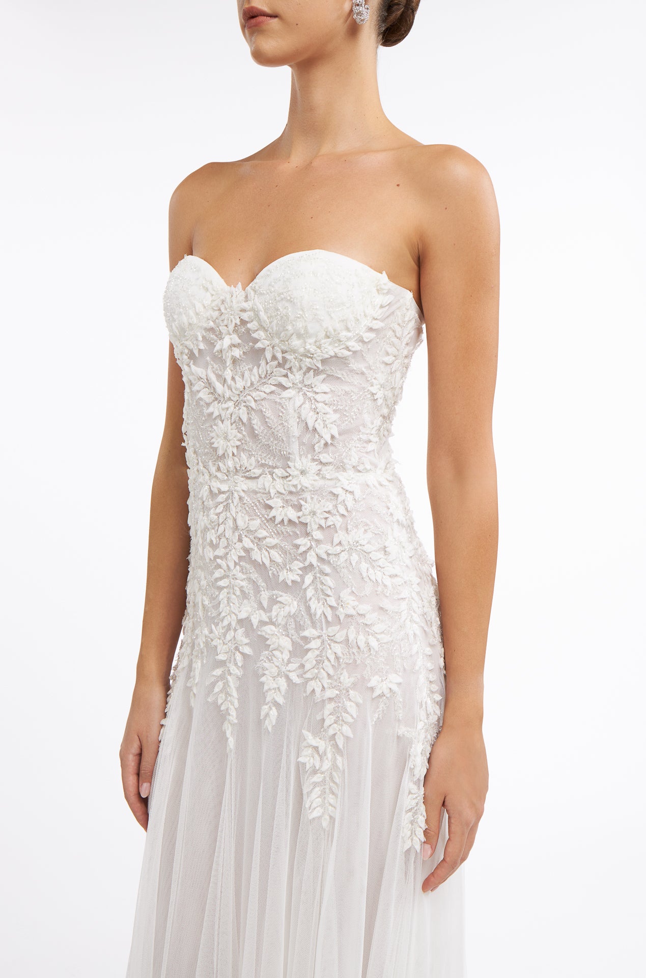 Close-up of the Matildie Beaded French Tulle Gown showcasing delicate floral embroidery, a structured bodice, and soft tulle layers.
