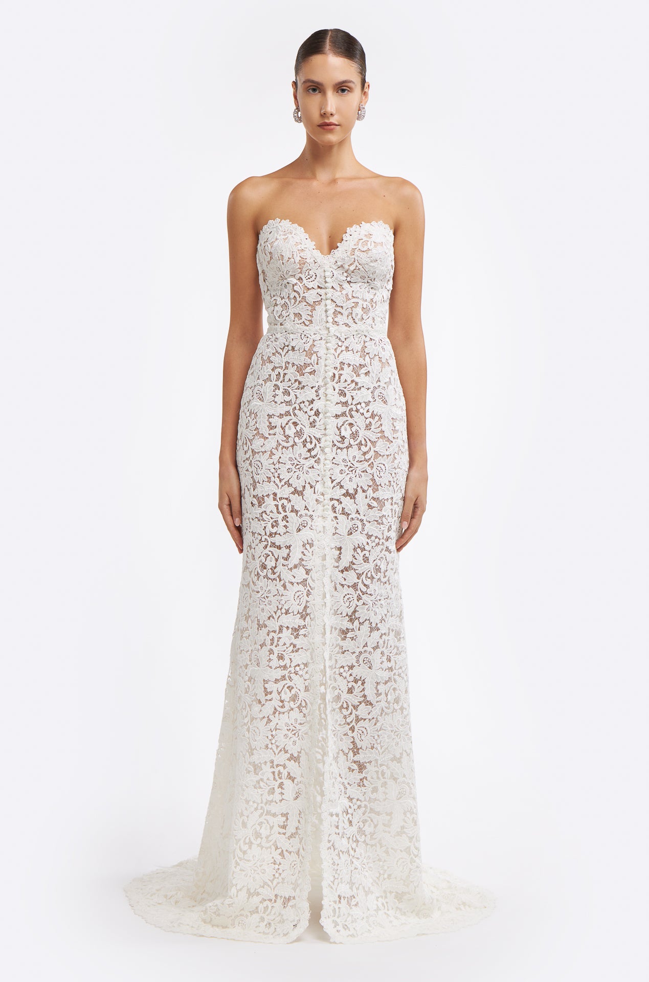 Valeria Corded Lace Strapless Gown featuring intricate lace detailing, a sweetheart neckline, and a fitted silhouette with a flowing train.