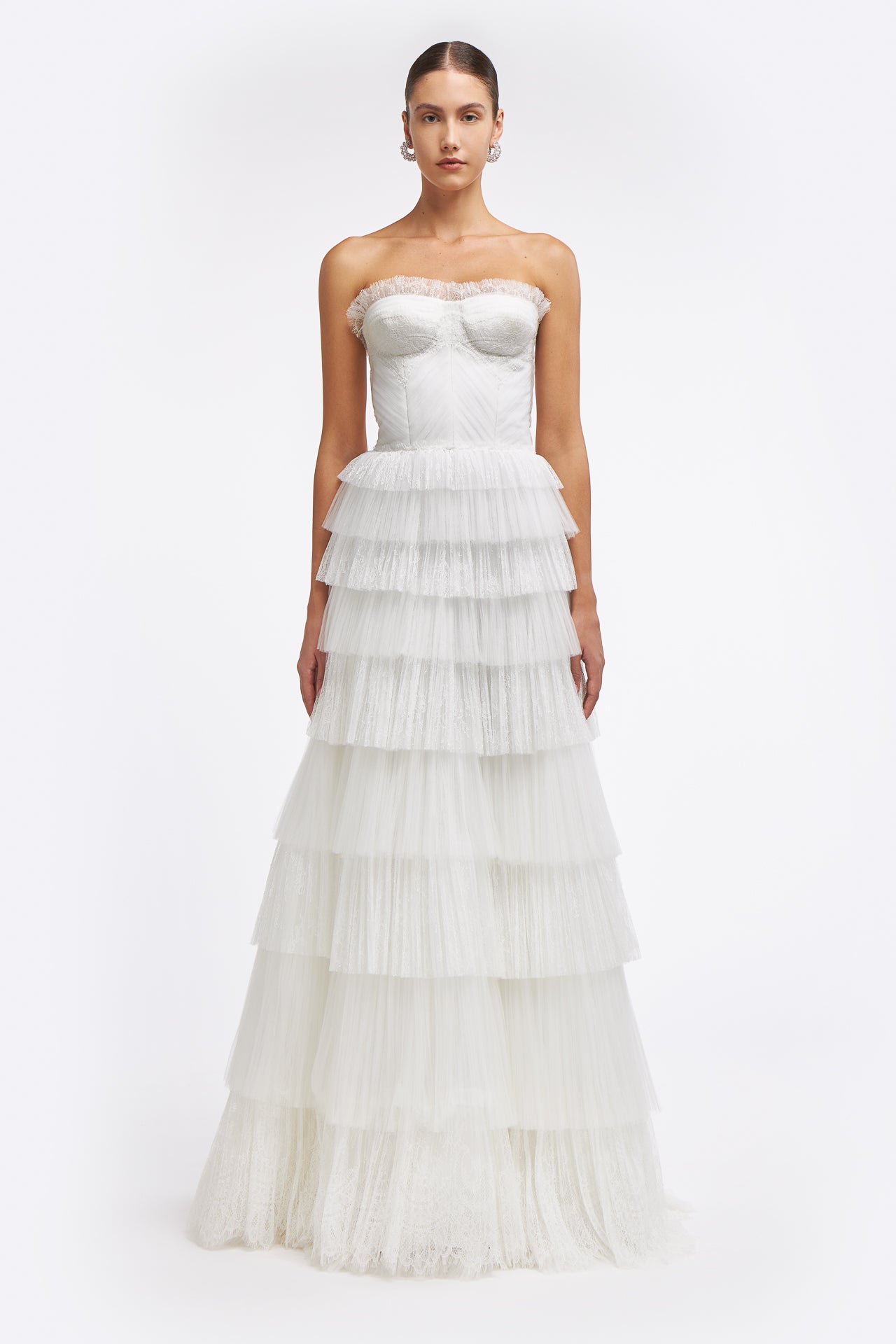 Ismene Plissé French Tulle Gown featuring a strapless corset bodice and tiered ruffle skirt, perfect for bridal elegance in Spring 2025.